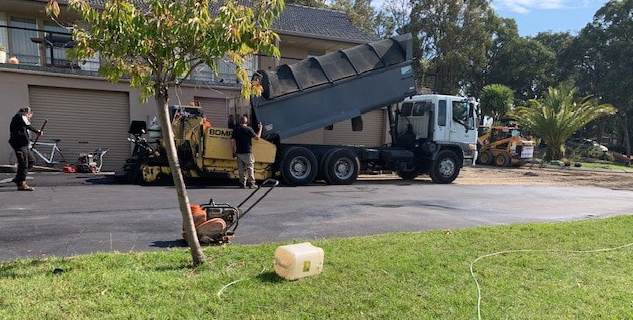 This is a photo of an asphalt driveway which is in the process of being installed by Byron Bay Asphalt & Bitumen Surfacing